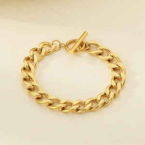 Detailed macro view of 18K gold plated Cuban chain bracelet with sleek toggle clasp