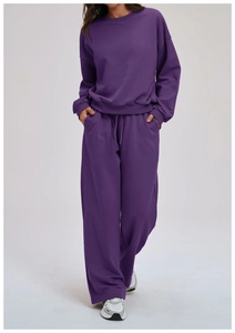 Detail of purple loose sweatshirt and wide-leg joggers set with drawstring and pockets