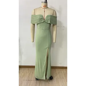 Detailed view of pale green off-shoulder evening dress with silver sequins and high slit