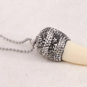 Vintage 85mm resin tusk pendant necklace with sparkling crystal encrusted metal sleeve