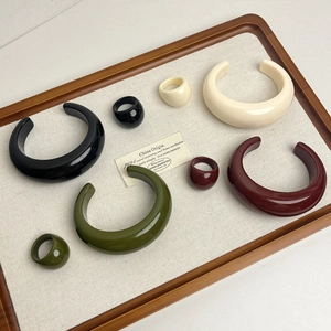 Minimalist chunky resin jewelry set with wide open bangles and matching rings