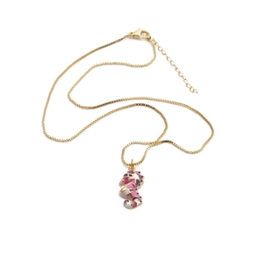 Gold plated box chain necklace with a pink and white enamel seahorse pendant on white background