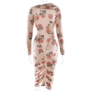 Detail of floral print pink dress with rose pattern and central ruched design
