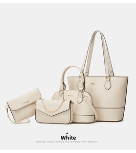 Detailed view of cream-white 4-piece fashion handbag set including tote and crossbody bags