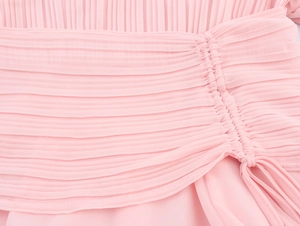 Detailed view of pink chiffon pleated fabric with side drawstring and fine stitching