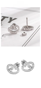 Macro shot of silver metal cloud stud earrings with micro-set white zircon and screw backs
