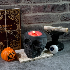Macro detail of a black skull storage jar candle holder for Halloween resin diy projects