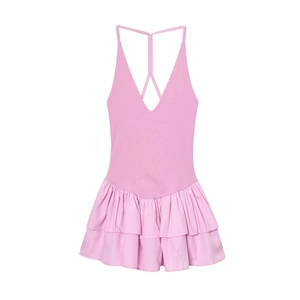 Pink halter neck mini dress with layered pleats and cross back straps on white background