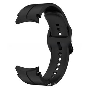Detail view of the curved interface and matte texture of the black silicone watch band