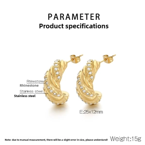 Detailed view of C-shaped gold stainless steel earrings with sparkling rhinestones