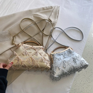 Detail of silver and gold evening bags with sparkling sequins and elegant tassels