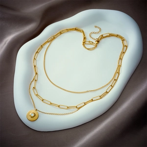 Three-layer 18k gold plated stainless steel necklace with sunburst pendant and paperclip chain