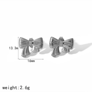 Macro shot of silver bow earrings with detailed measurements 16mm x 13.3mm and weight