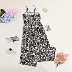 Flat lay of a leopard print wide leg jumpsuit with spaghetti straps on white background