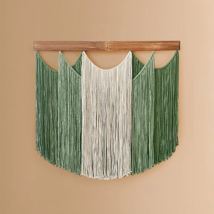 Bohemian handmade macrame wall hanging with forest green and cream cotton tassels