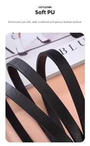 Detailed view of black PU leather belt with fine litchi texture on fashion magazine