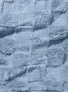 Close-up macro view of the soft blue fleece fabric with textured grid pattern detailing