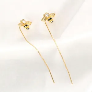 Long gold bee tassel earrings with clear crystals and delicate threader chains