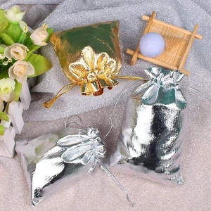 Elegant gold and silver drawstring jewelry pouches for gift packaging and storage