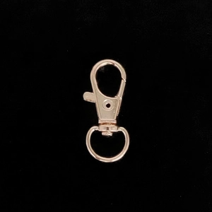 Detail of rose gold alloy lobster clasp with 360-degree rotating swivel ring