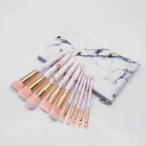 Professional 10-piece marble makeup brush set with rose gold accents and pink bristles