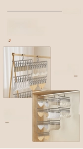 Detailed view of stainless steel sock drying rack with multiple clips for laundry storage