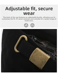 Detail of adjustable bronze metal buckle on vintage washed denim baseball cap