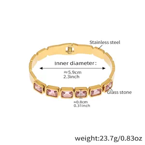 Detail of gold-plated stainless steel bracelet featuring square pink glass gemstones