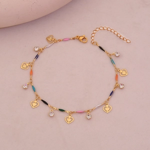 Detail of gold chain anklet featuring colorful enamel beads and hollow heart pendants
