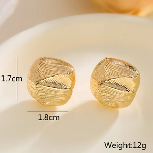 Macro shot showing dimensions and brushed texture of 18k gold plated geometric stud earrings