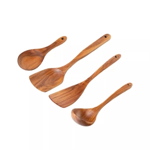 Four-piece teak wood cooking utensil set with long handles on white background