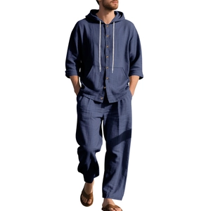 Detail of navy blue linen hoody with wooden buttons and drawstring on a beach casual set