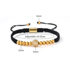 Detail view of adjustable black cord bracelet with gold beads and zircon paved sphere