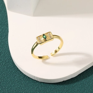 Minimalist 18K gold plated ring featuring a green marquise stone and white cubic zirconia