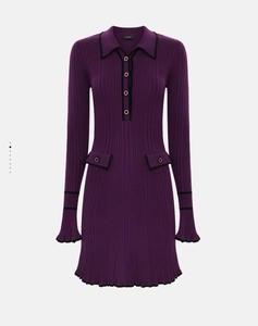 Detail of purple knit dress with Polo collar, black trim, and golden button accents