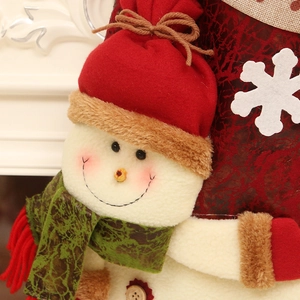 Christmas stocking with detailed snowman character and snowflake on red marble fabric