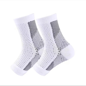 White compression ankle sleeves with black geometric patterns and breathable mesh design