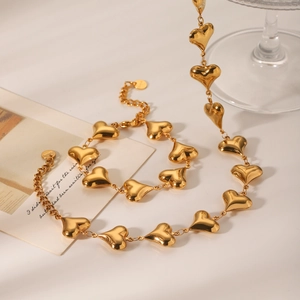 18K gold-plated hollow heart link necklace with adjustable chain on minimalist white background