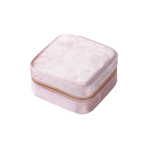 Pink velvet jewelry organizer box with gold zipper and double-layer storage design