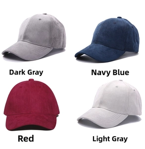 Detail of suede baseball caps in dark grey, navy, red, and light grey colors
