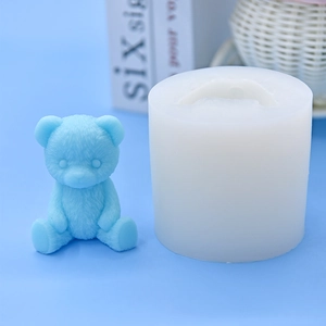 Detailed view of high-precision silicone mold and finished teddy bear candle with 3D fur texture