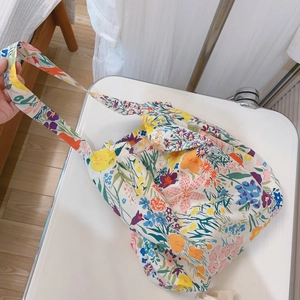 Floral print cotton shoulder bag with colorful lily and daisy patterns for summer