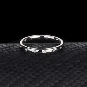 Elegant silver thin band ring with sparkling cubic zirconia stones in a minimalist style