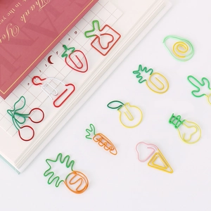 Colorful creative fruit shaped metal paperclips including carrot and pineapple designs