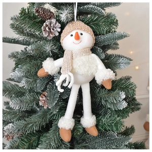 Detail of plush Christmas snowman hanging on a tree with knitted hat and long legs