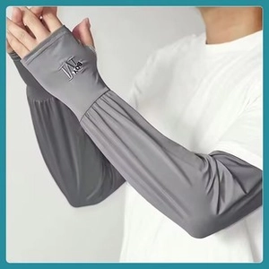 Detailed view of gray sun protection sleeve with pleated design and brand logo
