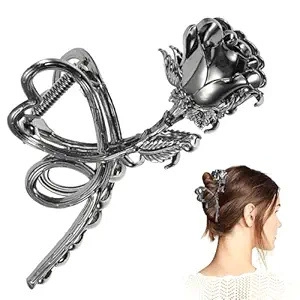 Detail of silver metal rose hair claw clip showing intricate petal textures and sleek finish