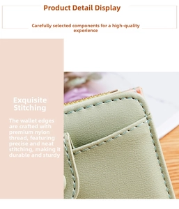 Detail of light green litchi texture leather wallet with fine nylon stitching and zipper
