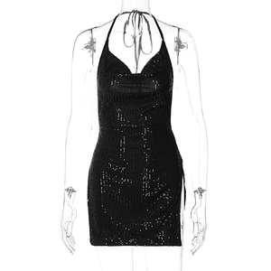 Detail view of black sequin halter mini dress featuring side slit and backless cut