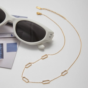 Detail of 18K gold stainless steel chain with sparkling zircon rectangular links
